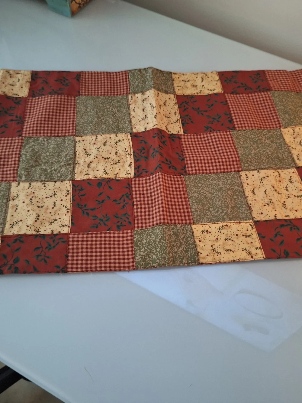 Patchwork Quilted Table Runner in Red, Green, and Cream